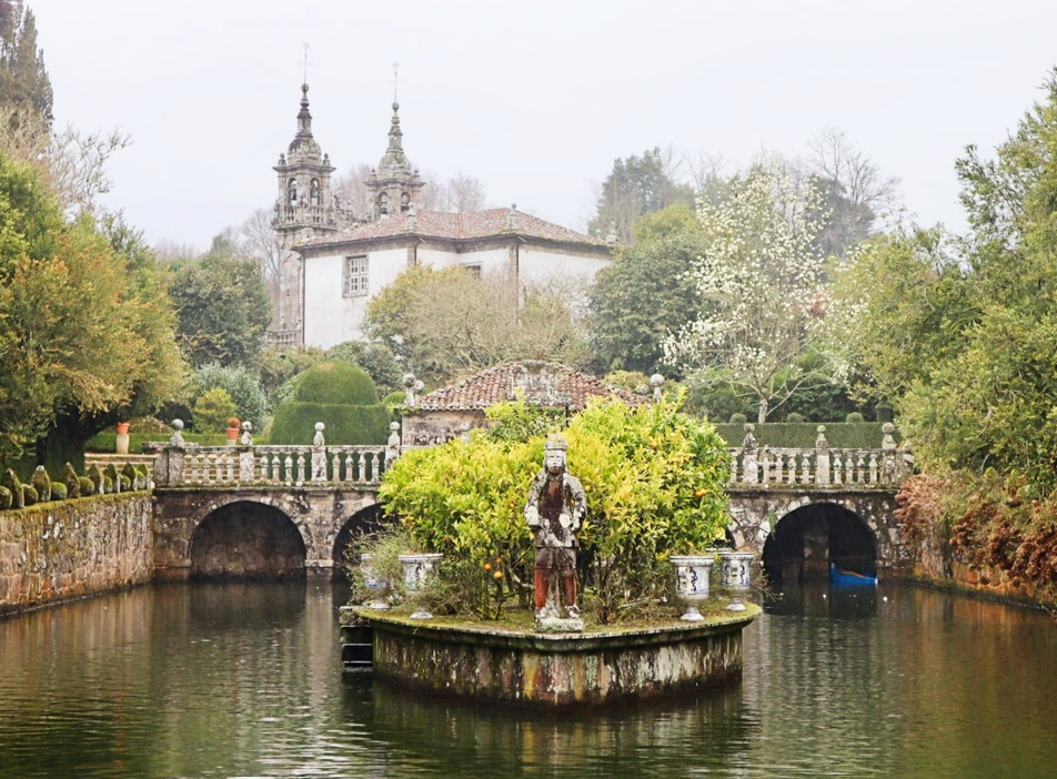 Historic Galician pazo overlooking formal gardens and an ornamental pond
